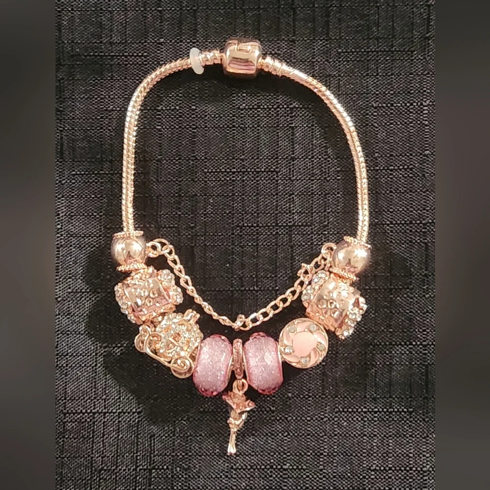 Gold and Pink Charm Bracelet with Ornate Charms. ITEM No. 19-144